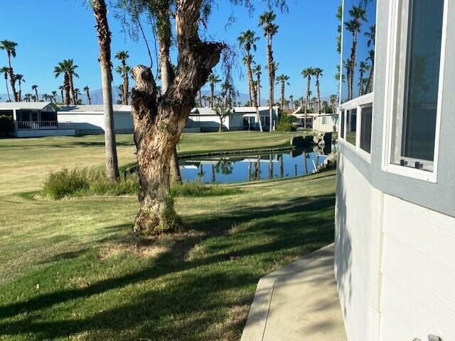84136 Ave 44, Unit 694 Indio, CA 92203 - Photo 7 of 20 a view of a swimming pool with a patio