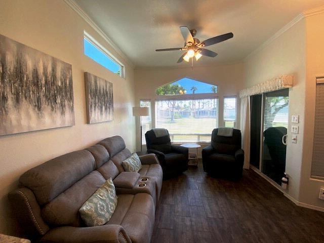 84136 Ave 44, Unit 694 Indio, CA 92203 - Photo 9 of 20 a living room with furniture and a chandelier