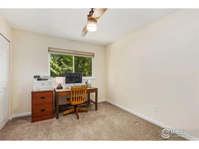 a workspace with furniture and a window