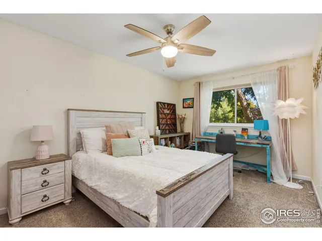 a bed room with a bed and a chandelier
