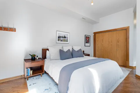 a bedroom with a bed and a table in it