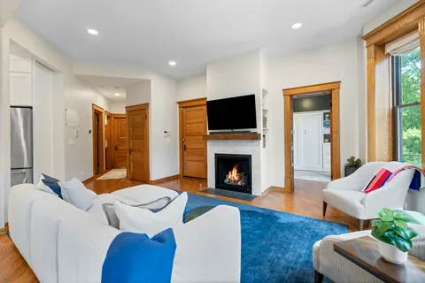 a living room with furniture and a fireplace