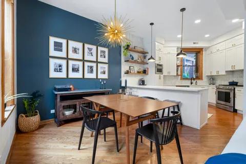 a dinning table and chairs in the kitchen