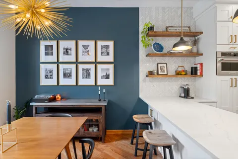 a dining room with furniture and window