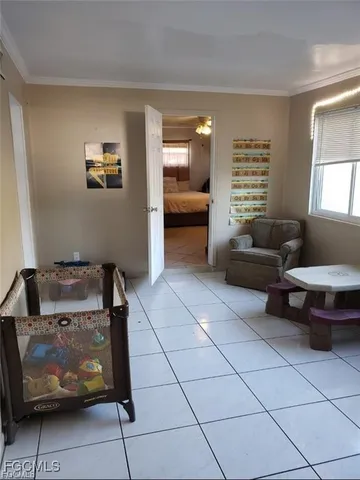 a living room with furniture and a window