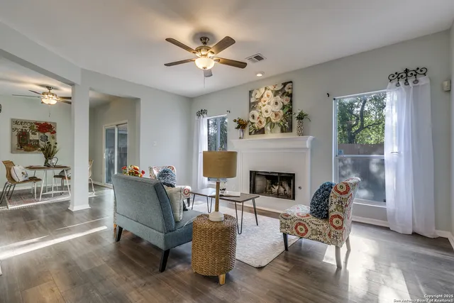 a living room with furniture and a fireplace