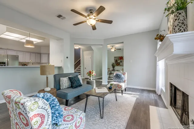 a living room with furniture and a fireplace