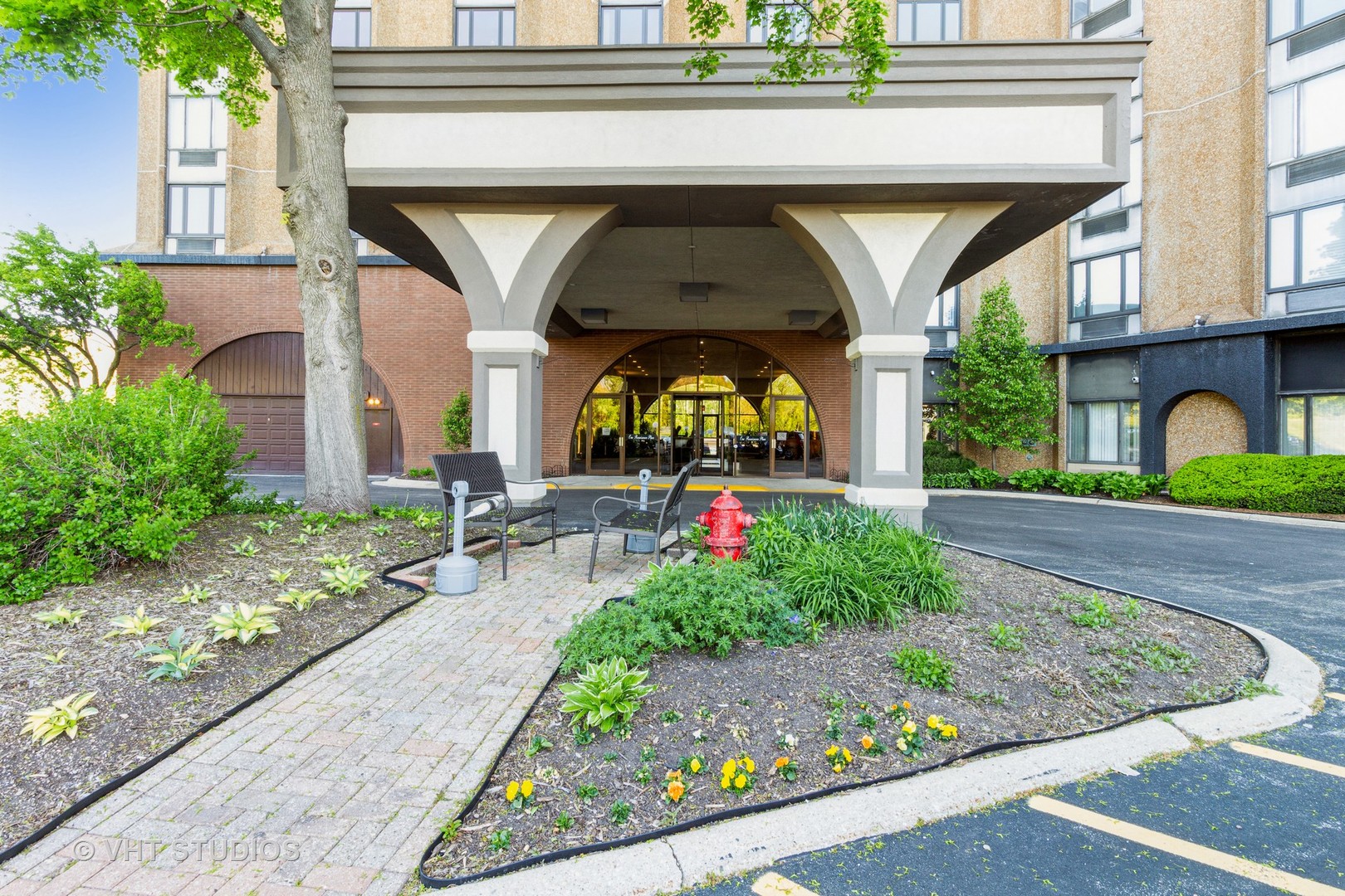 a view of swimming pool with outdoor seating and plants
