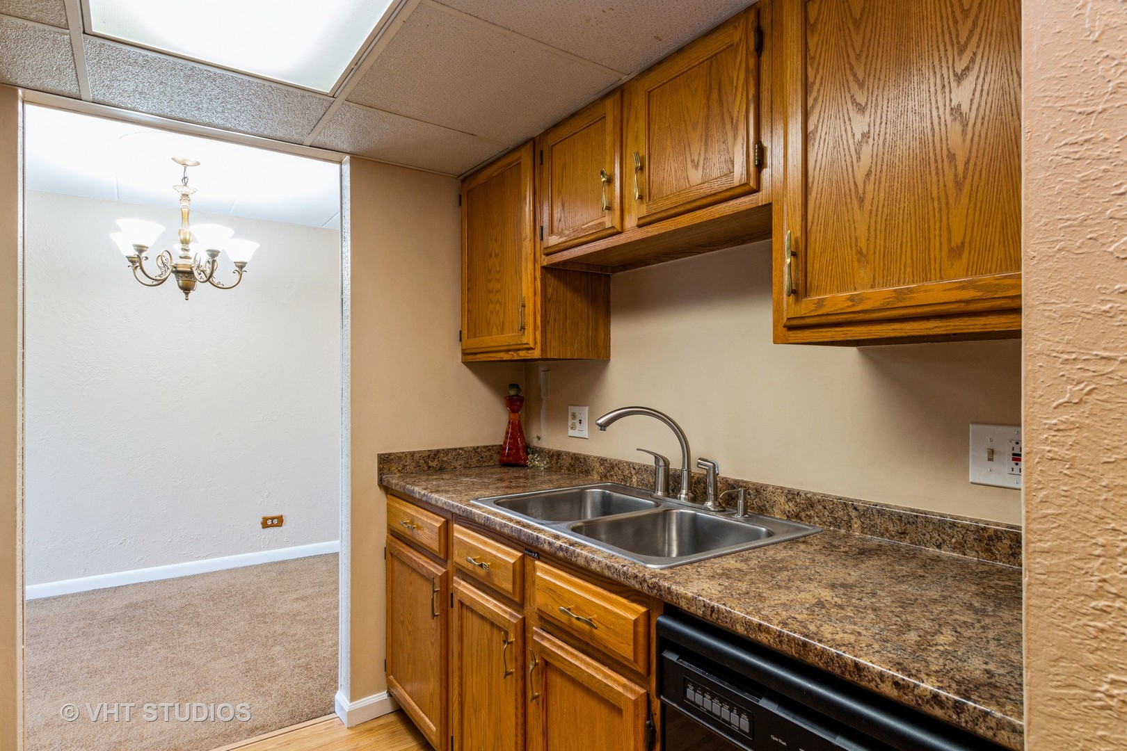 1 Renaissance Place, Unit 316 Palatine, IL 60067 - Photo 2 of 11 a kitchen with granite countertop stainless steel appliances a sink and cabinets