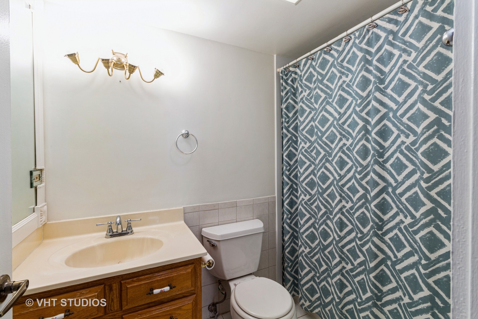 1 Renaissance Place, Unit 316 Palatine, IL 60067 - Photo 9 of 11 a bathroom with a sink and a toilet