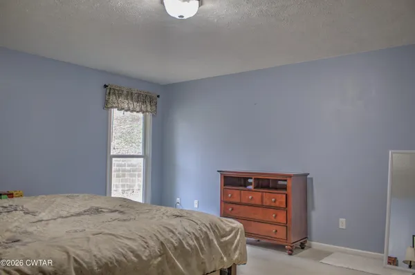 a bedroom with a bed and a closet