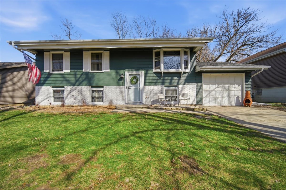 308 Columbia Drive Normal, IL 61761 - Photo 1 of 30 a view of a house with pool and chairs