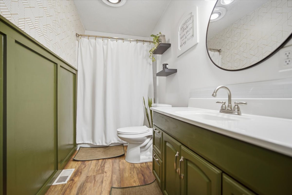 308 Columbia Drive Normal, IL 61761 - Photo 15 of 30 a bathroom with a sink a toilet and a mirror