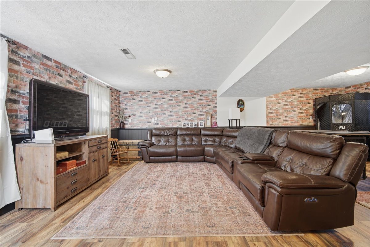 308 Columbia Drive Normal, IL 61761 - Photo 18 of 30 a living room with furniture and a flat screen tv