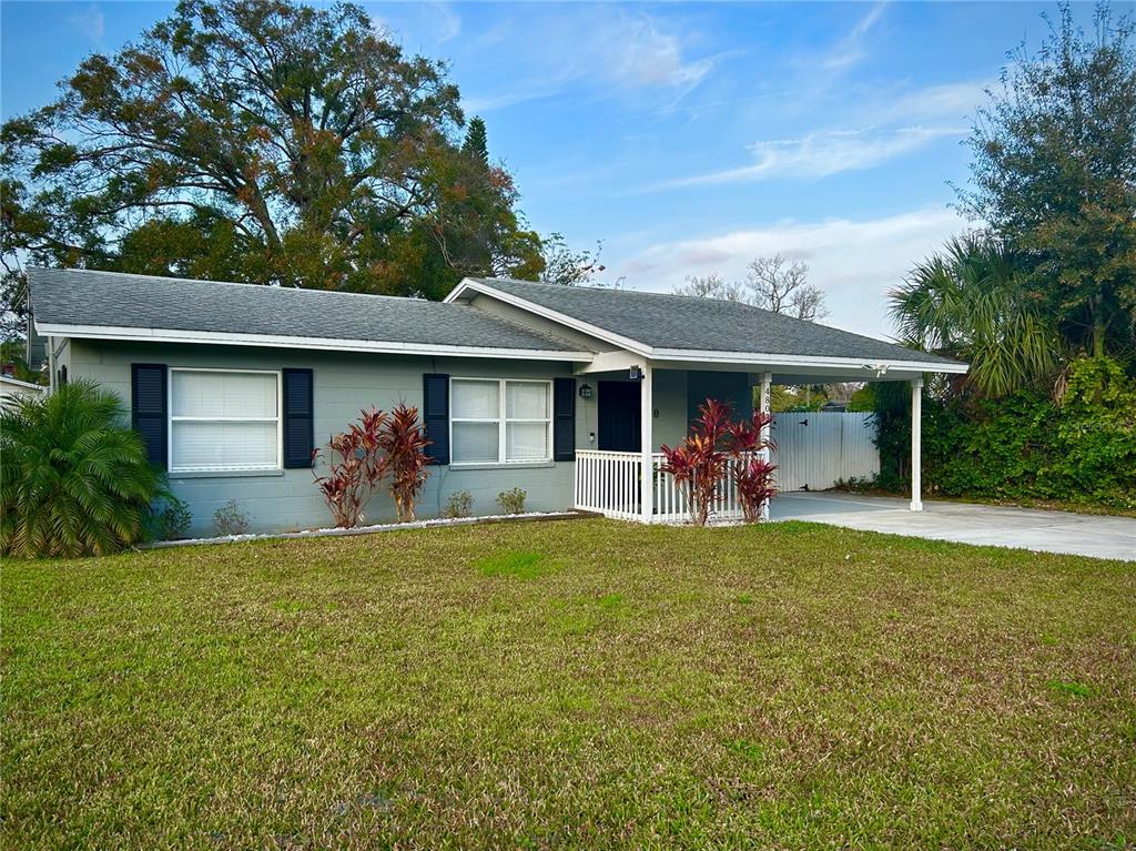 4803 Roush Avenue Orlando, FL 32803 - Photo 1 of 1 a front view of a house with a garden and porch