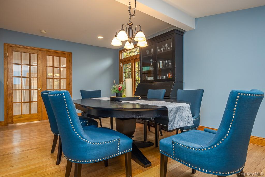 101 Hickory Hill Road Tappan, NY 10983 - Photo 14 of 40 a view of a dining room with furniture window and wooden floor