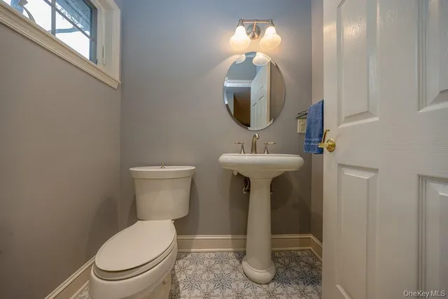 a kitchen with a sink cabinets and appliances