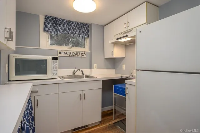 a view of workspace with furniture and windows