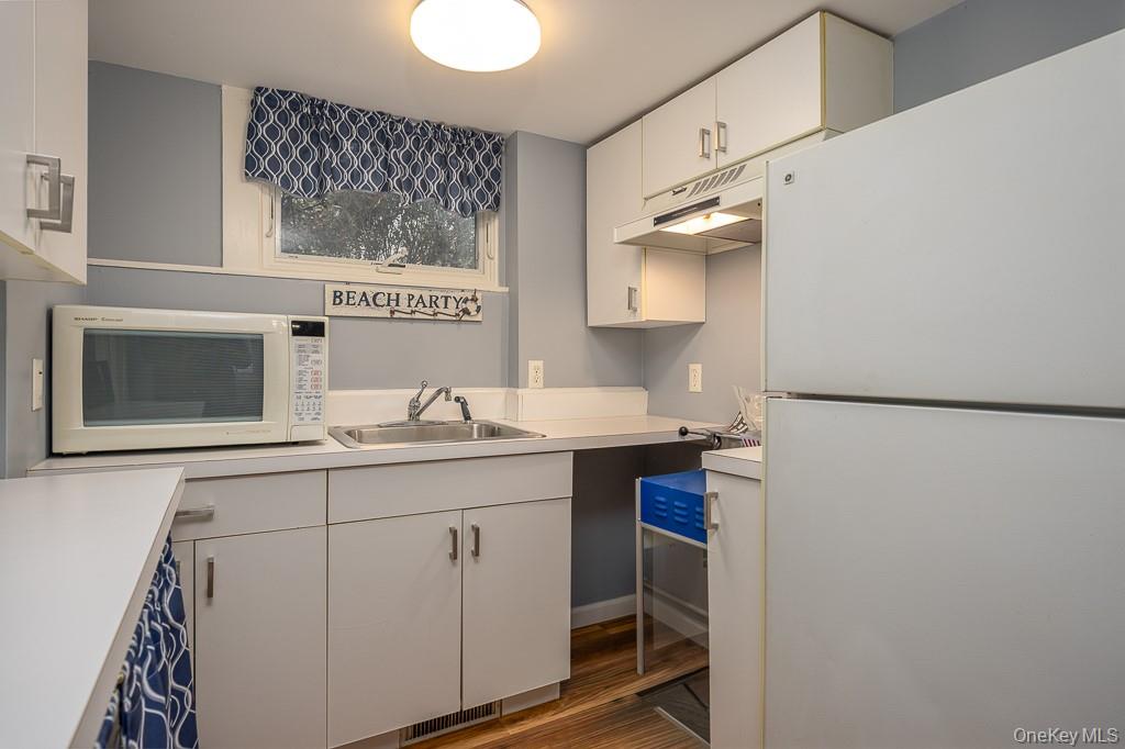 101 Hickory Hill Road Tappan, NY 10983 - Photo 22 of 40 a kitchen with a sink cabinets and appliances