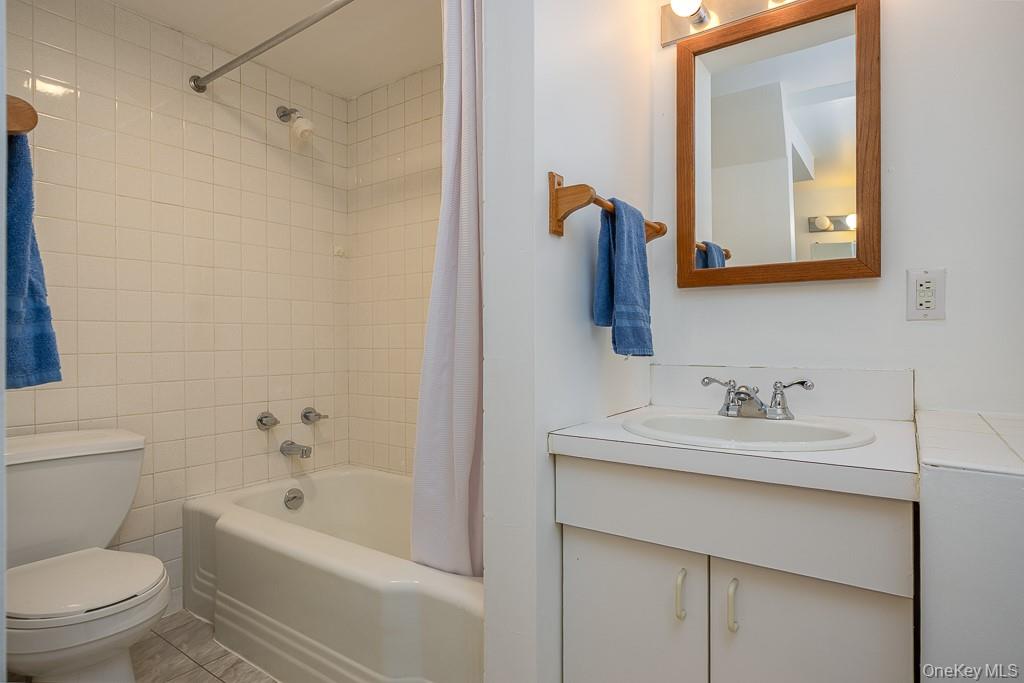 101 Hickory Hill Road Tappan, NY 10983 - Photo 25 of 40 a bathroom with a sink a toilet and shower
