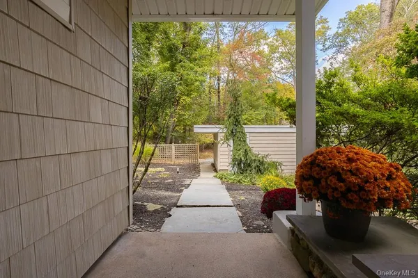 a garden with trees in front of it