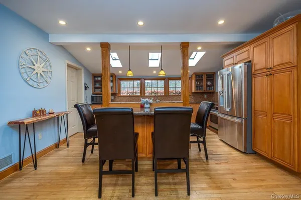 a dining area with furniture and window