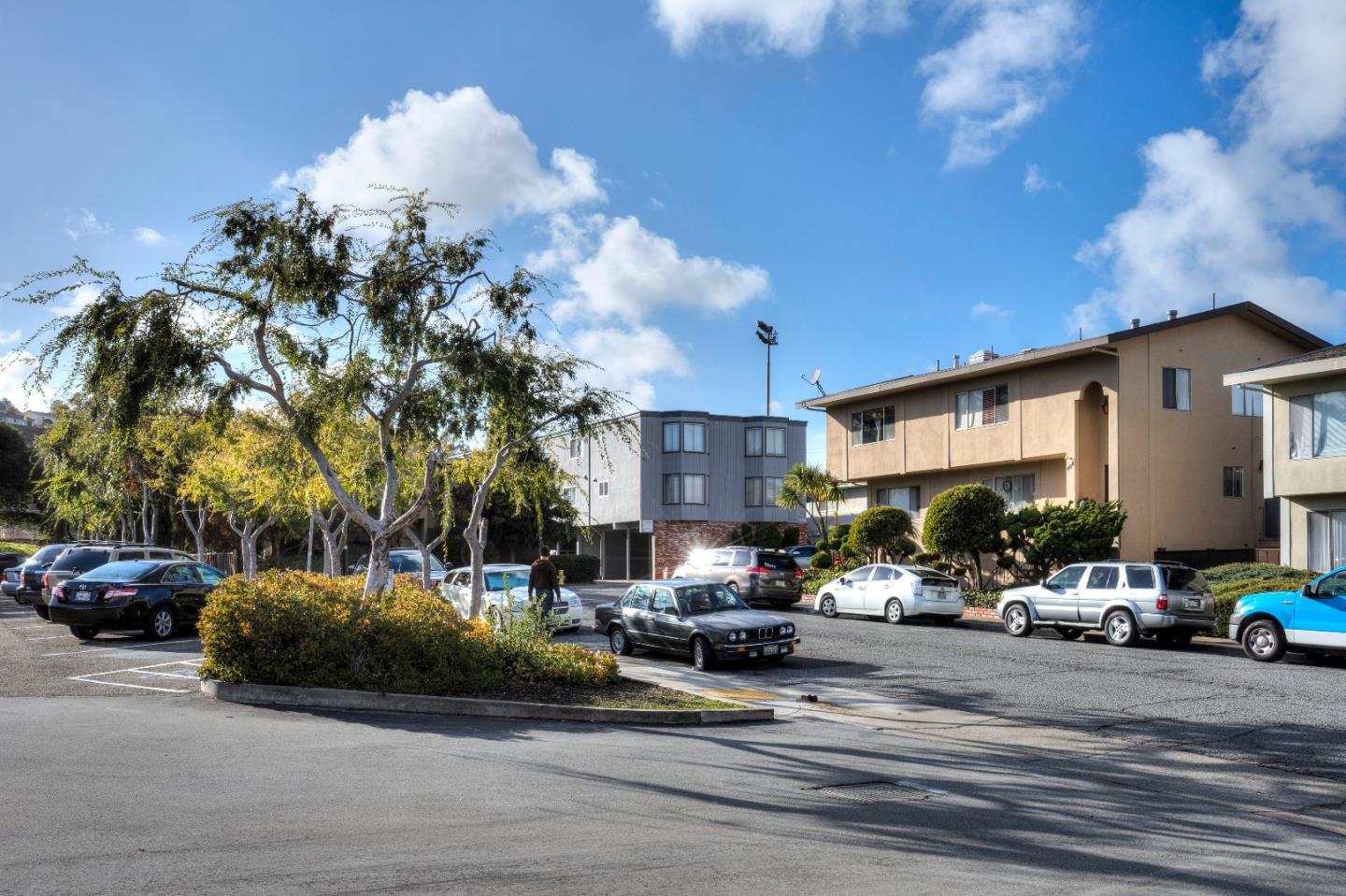 481 Lincoln Circle Millbrae, CA 94030 - Photo 20 of 24 a view of a cars park in front of a house