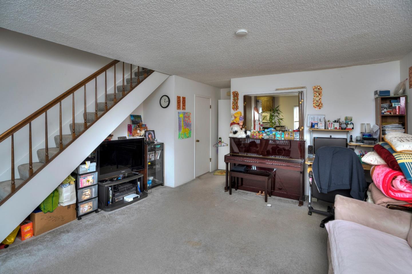 481 Lincoln Circle Millbrae, CA 94030 - Photo 10 of 24 a living room with furniture a flat screen tv and a fireplace