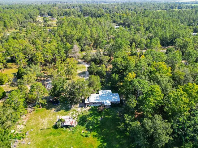 a backyard of a house with a yard and lake view