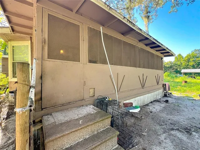 a room that has a chair and a window