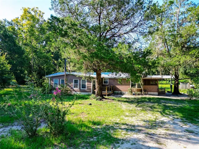 a view of a chair and table in the garden