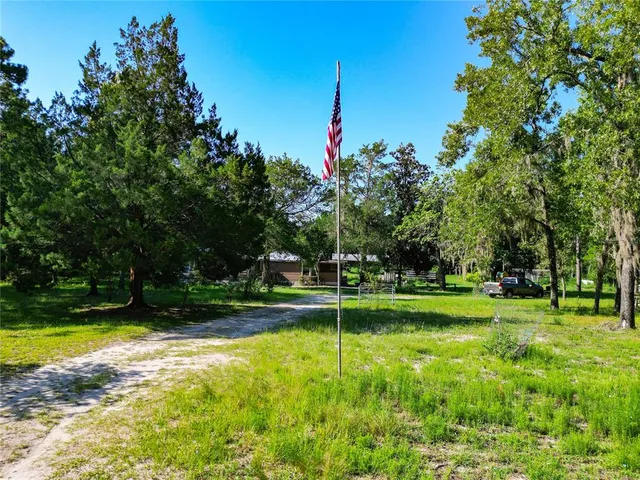 a view of a yard with an outdoor seating