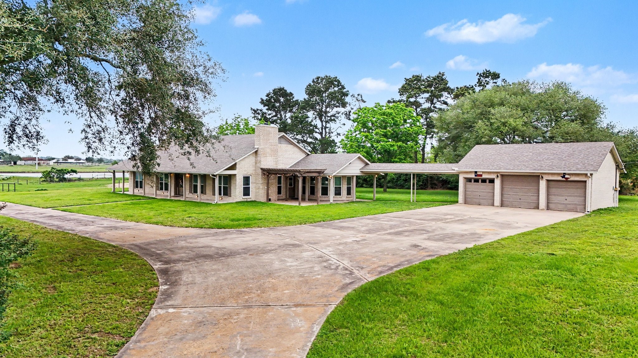 35564 Brumlow Road Hempstead, TX 77445 - Photo 33 of 46 a view of a house with a big yard and large trees