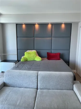 a bedroom with a bed and walk in closet