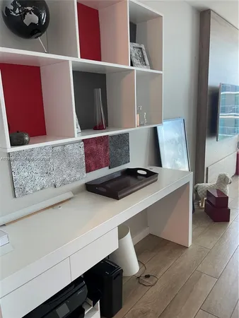 a living room with a couch and a potted plant