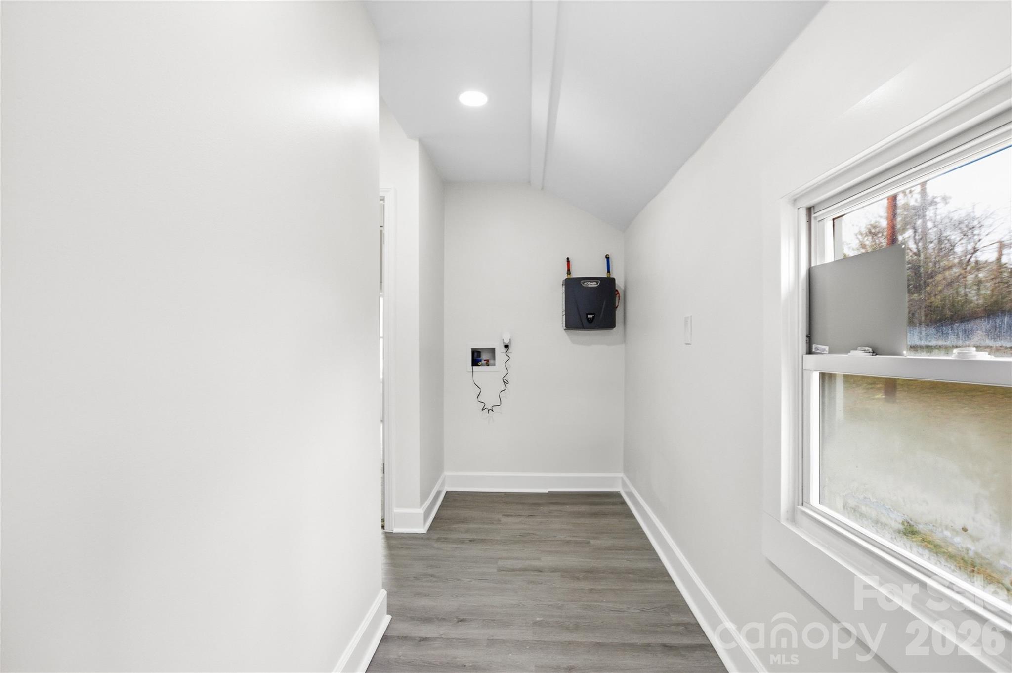 706 Sweeney Street Chester, SC 29706 - Photo 13 of 20 a view of hallway with window and wooden floor