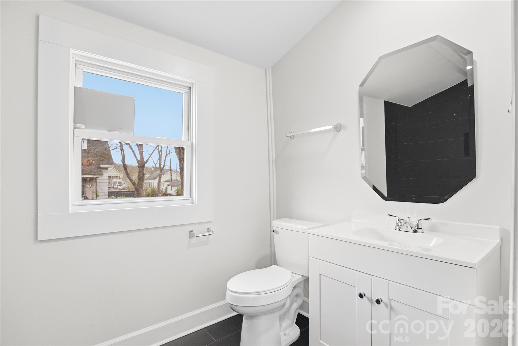 706 Sweeney Street Chester, SC 29706 - Photo 14 of 20 a bathroom with a toilet sink and mirror