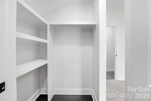 a view of an empty walk in closet