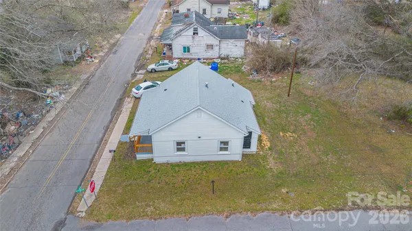 a view of a house with a small yard