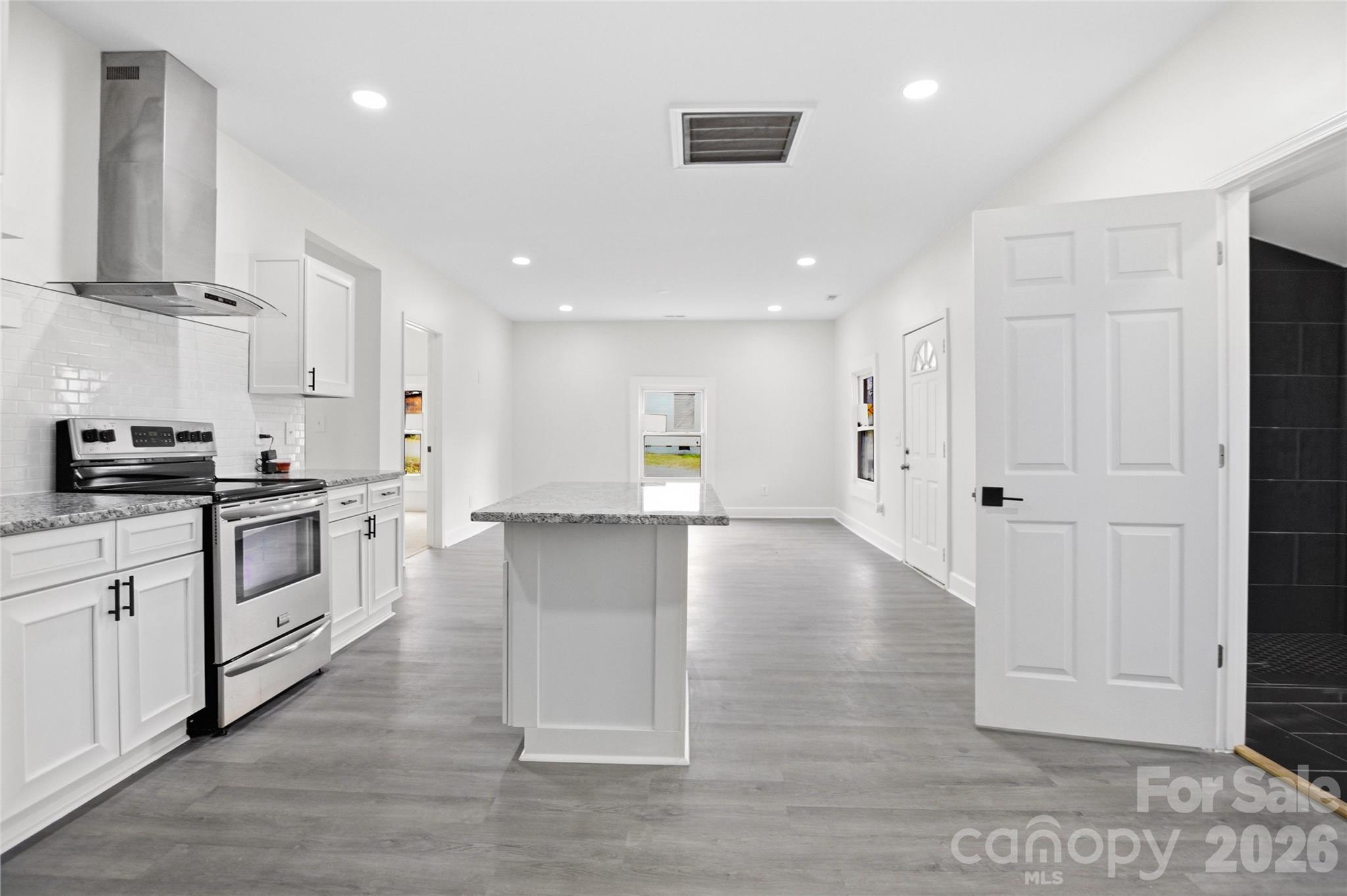 706 Sweeney Street Chester, SC 29706 - Photo 9 of 20 a view of kitchen with wooden floor and electronic appliances