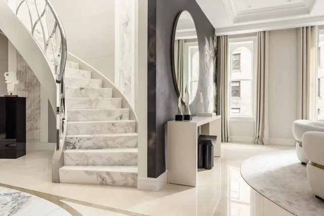 a kitchen with stainless steel appliances kitchen island granite countertop a sink and a stove