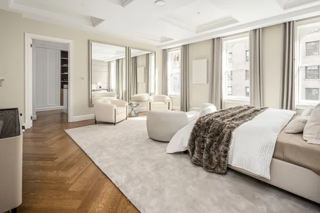 a view of a living room and dining room with furniture