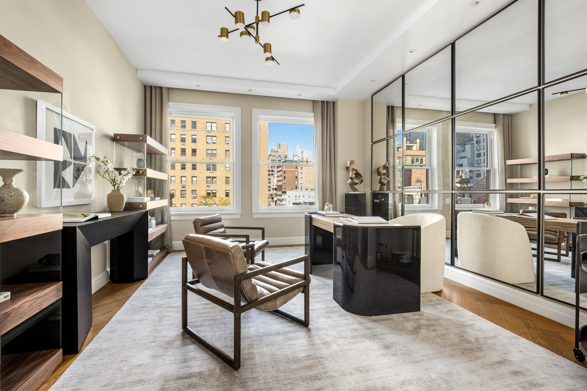 133 East 73rd Street, Unit PH Manhattan, NY 10021 - Photo 17 of 37 a living room with furniture a large window and kitchen view