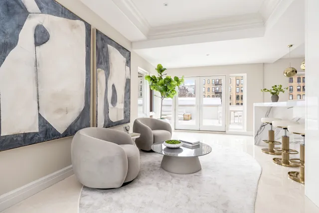 a view of a patio with couches table and chairs and potted plants