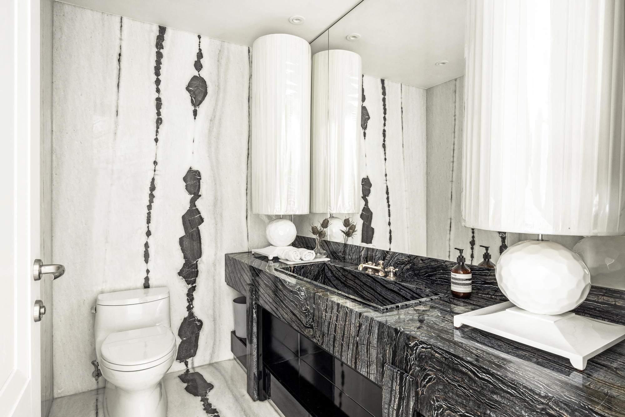 133 East 73rd Street, Unit PH Manhattan, NY 10021 - Photo 27 of 37 a bathroom with a granite countertop sink and a mirror