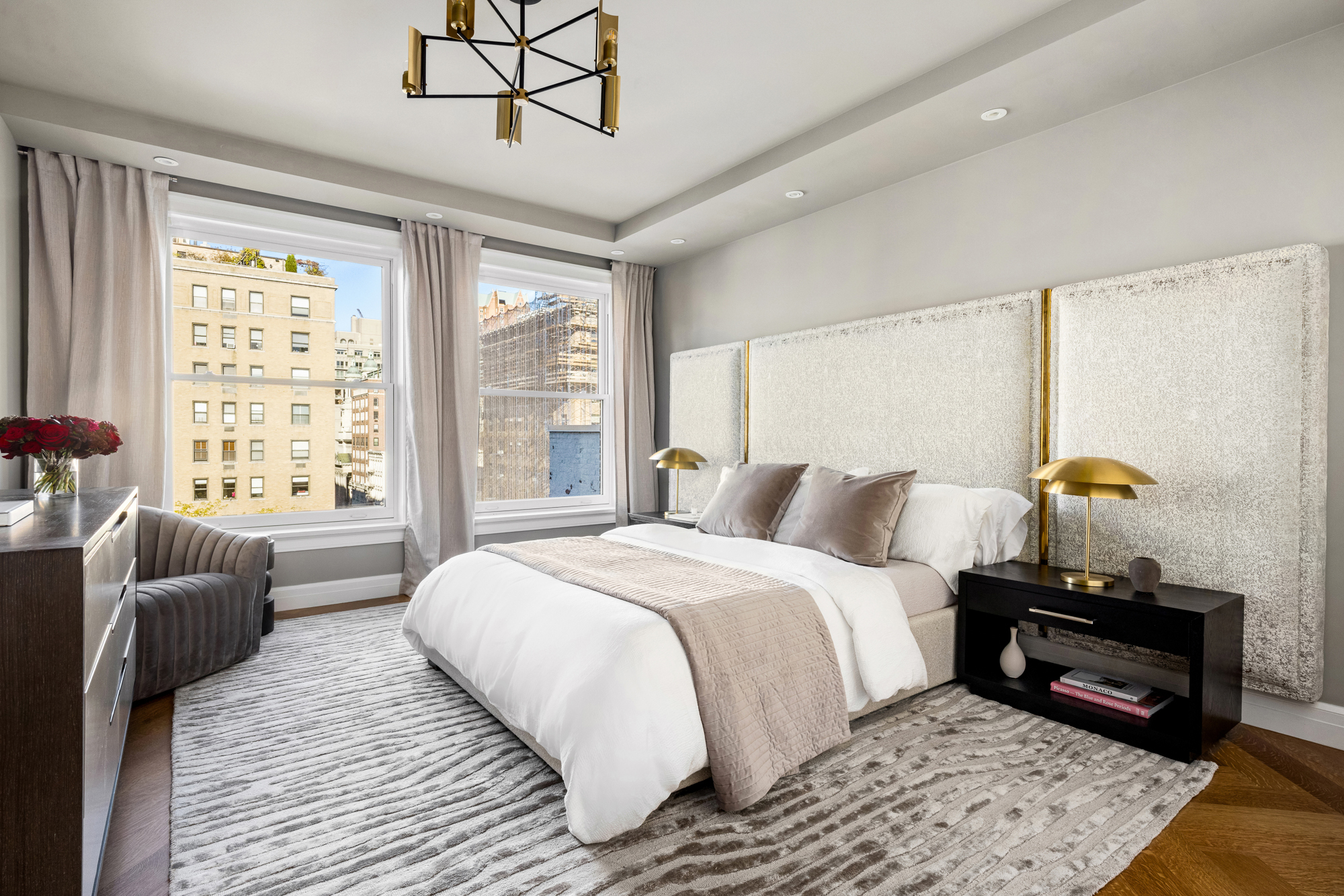 133 East 73rd Street, Unit PH Manhattan, NY 10021 - Photo 28 of 37 a bedroom with a bed and wooden floor