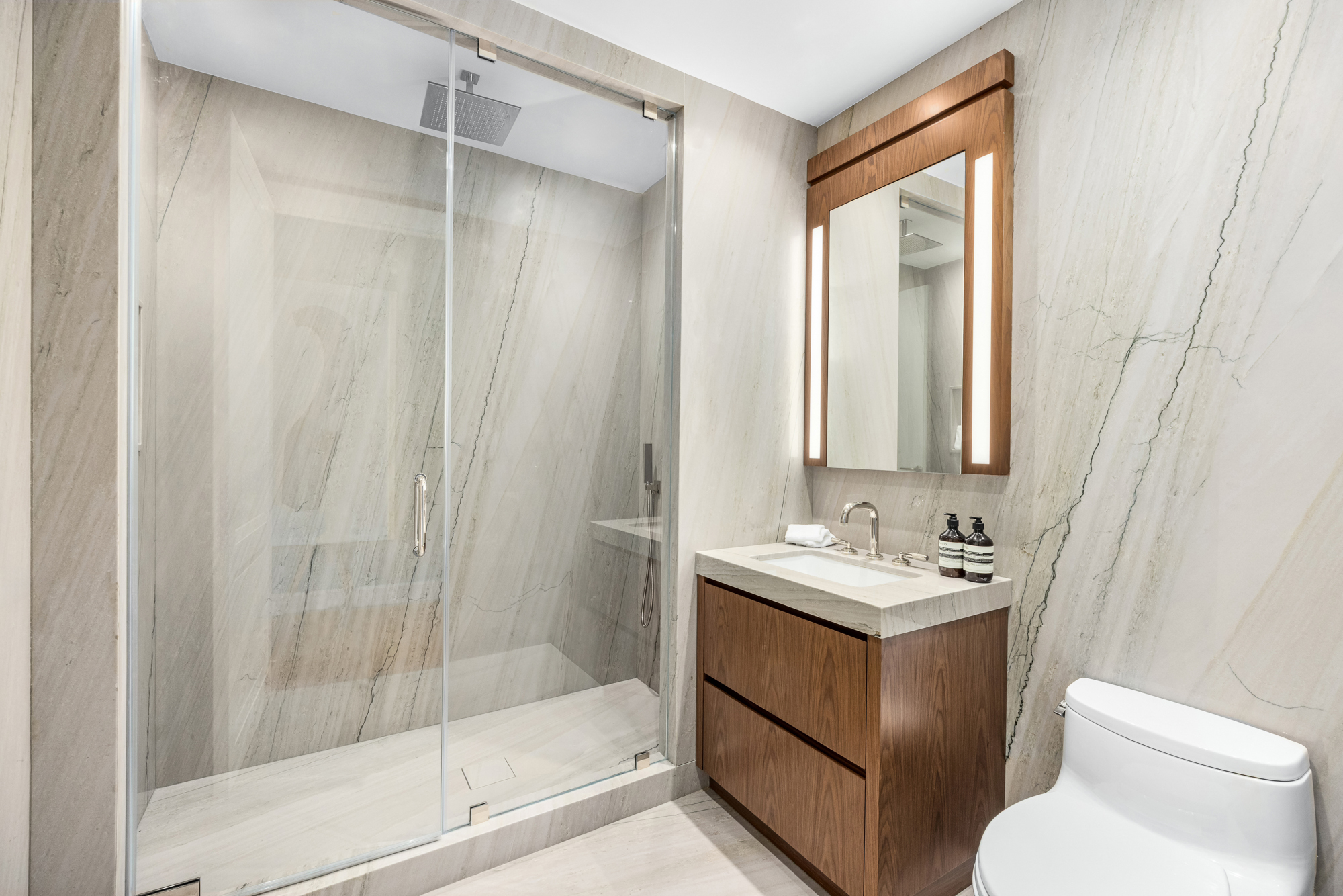 133 East 73rd Street, Unit PH Manhattan, NY 10021 - Photo 29 of 37 a bathroom with a sink a toilet and shower