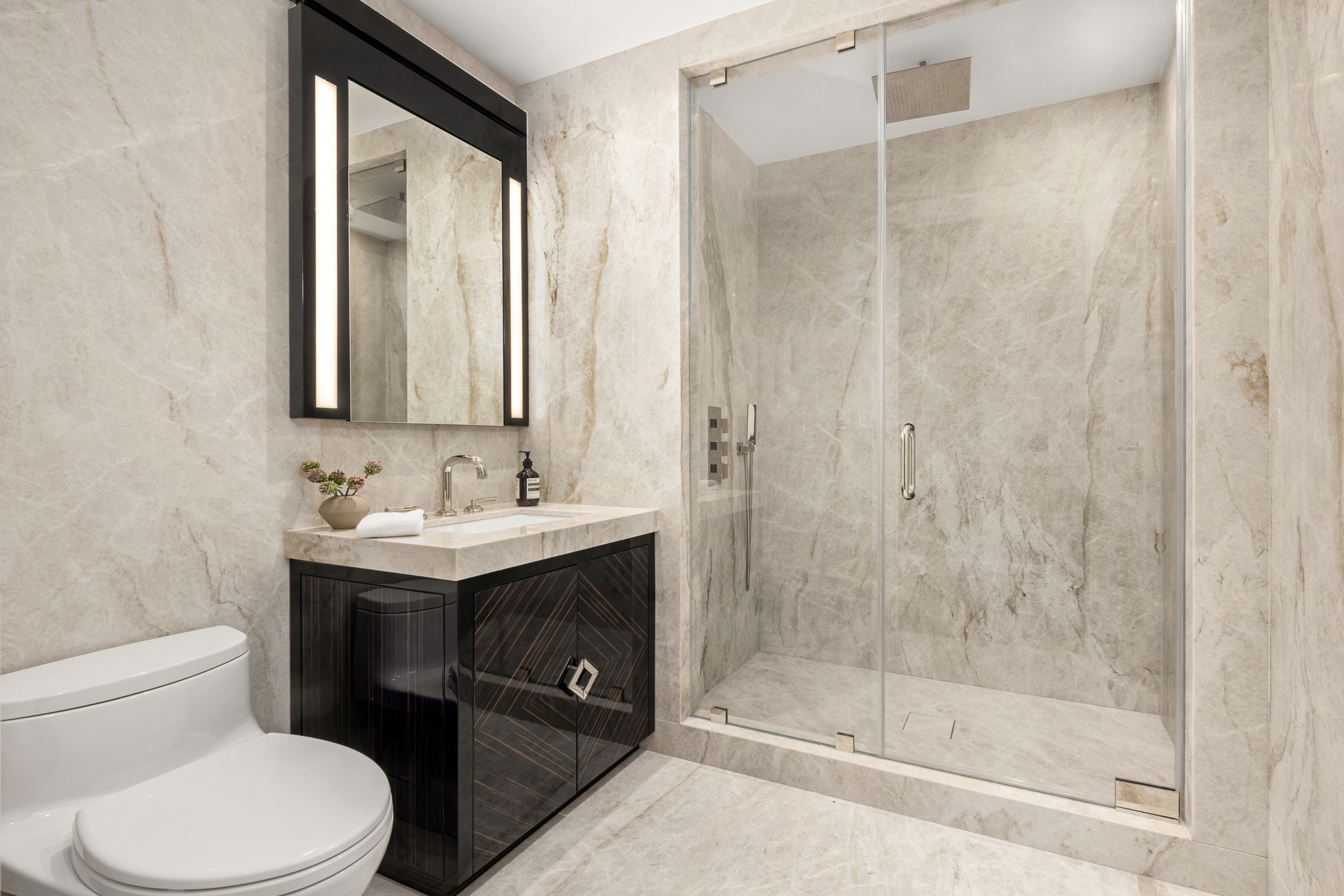 133 East 73rd Street, Unit PH Manhattan, NY 10021 - Photo 31 of 37 a bathroom with a sink a toilet and shower