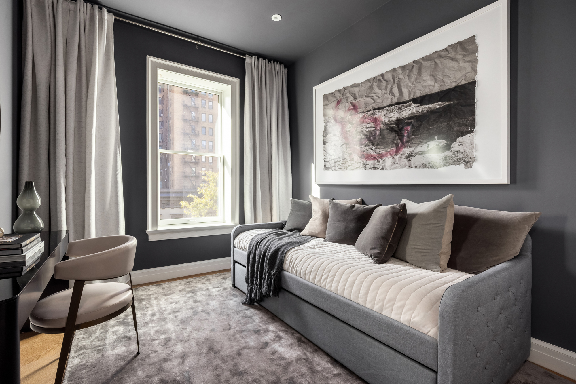 133 East 73rd Street, Unit PH Manhattan, NY 10021 - Photo 33 of 37 a living room with furniture and a large window