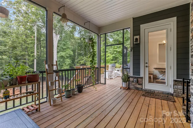 a view of balcony with wooden floor